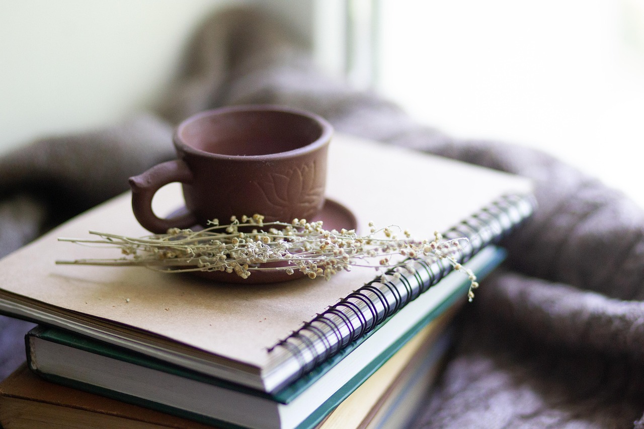 Books, cup, herbs — Know Whether CBD Can Help College Students