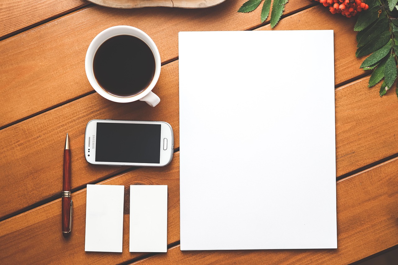 Coffee, phone, paper — Mobile Experience Review of BetOnline Poker