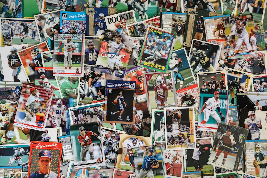 A collection of various sports trading cards scattered on a surface, showcasing different players and teams.