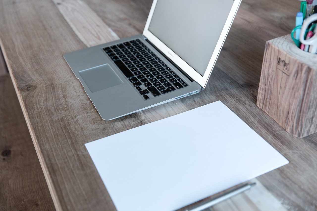 Home office, laptop, notebook — What is Cold Emailing?